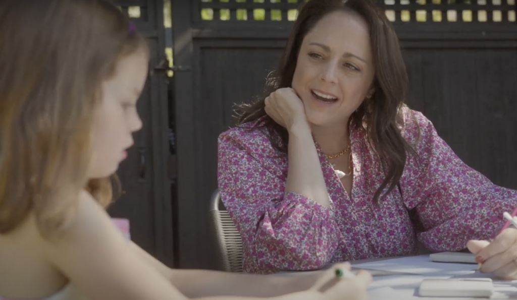 A photo of Sara at home with her daughter.