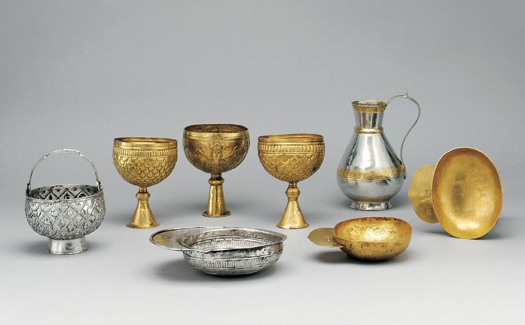 Examples of Avar Treasure that include gold and silver chalices and plates.