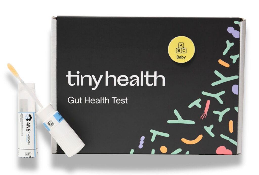 An at-home gut health testing kit with its sample collection tube.