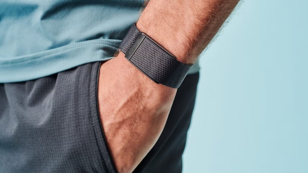 A screenless fitness band worn on a wrist during a workout.
